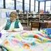 Fifth-grade student and girl scout Abby Warrick writes a letter to a New Hope Baptist Church recipient on Tuesday, Jan. 22. Abby came up with the idea while watching the news. "I wanted people who don't have homes to have a blanket to stay warm during the winter," she says. Daniel Brenner I AnnArbor.com